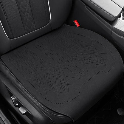 Car seat cushion in dark fabric with laser-perforation pattern and stitched border