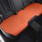 Car seat cushion in orange fabric on rear seat, stitched edges and perforated pattern