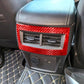Rear air vent frame sticker installed, carbon-fiber red with rectangular cutout over vent