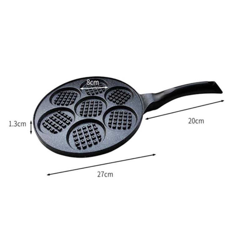 Round nonstick egg burger pan with 7 cups and waffle-textured cavities, black handle.