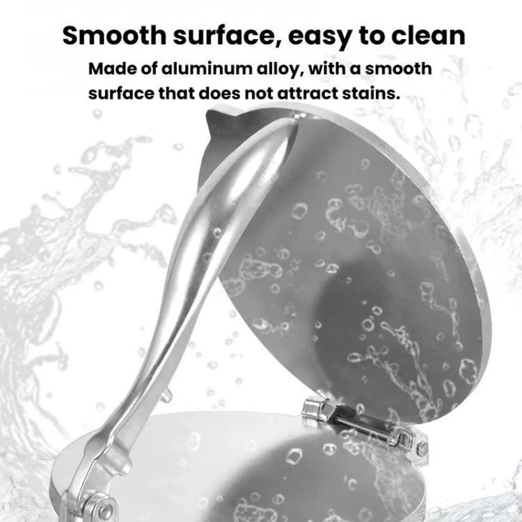 Silver dough press mold with smooth curved surfaces and riveted hinge points