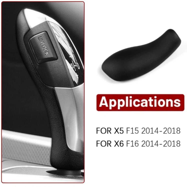 Black gear shift knob cover close-up fitted to shift lever with silver surrounding trim.