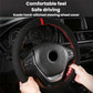 Suede steering wheel cover on car wheel, black with red stitched trim