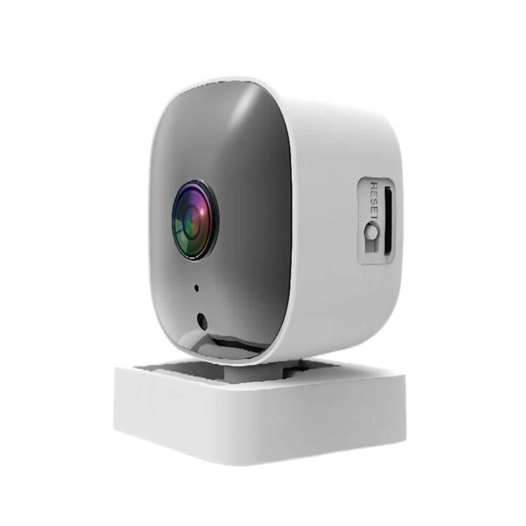 White indoor surveillance camera standing on square base, black front with lens