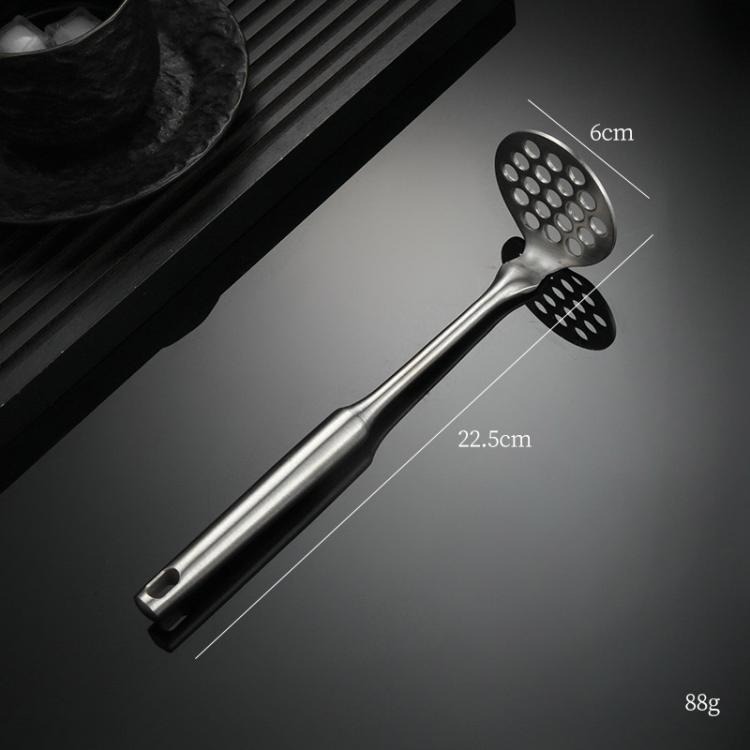 Stainless steel potato masher with round perforated head on long handle