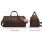 Brown leather duffel-style travel tote bag with two handles, side straps, front detail.