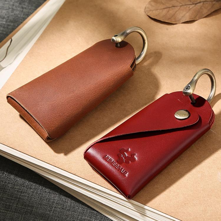 Leather key pouches in brown and red with metal keyrings and snap closures