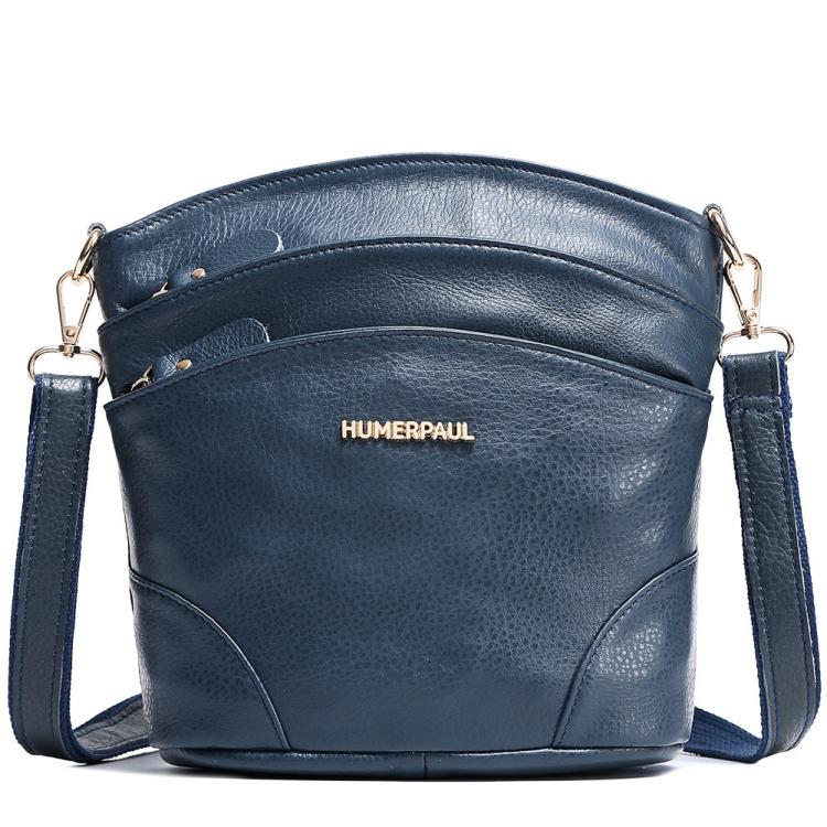 Blue leather shoulder crossbody bag with flap front and adjustable shoulder strap