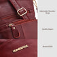 Red leather crossbody bag close-up of zipper, logo, and adjustable shoulder strap