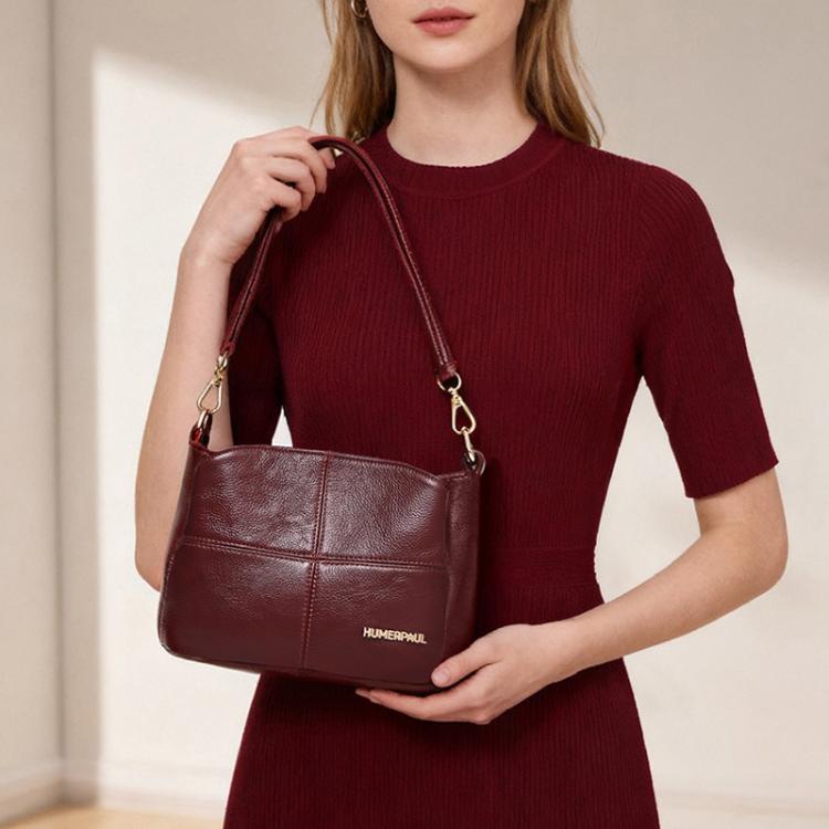 Burgundy leather crossbody shoulder bag with chain straps and front logo patch