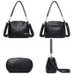 Black leather shoulder bag set with chain straps, front pocket, and detachable crossbody strap