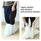 Resilient white cat litter liner bag being lifted by tied handles