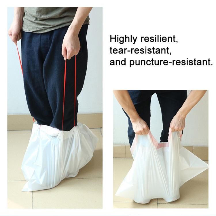 Resilient white cat litter liner bag being lifted by tied handles