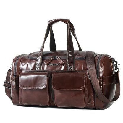 Brown leather duffel bag with two front pockets, top handles, and shoulder strap
