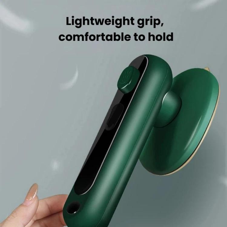 Green handheld garment steamer with ergonomic grip and steam outlet nozzle
