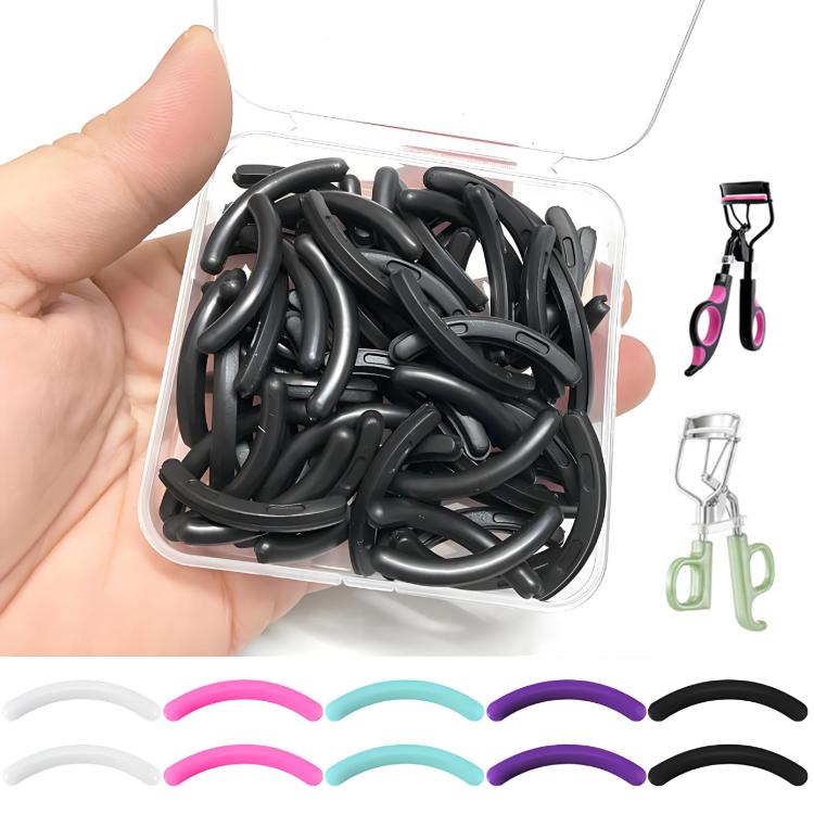 Clear box of eyelash curler refill pads, black and pastel curved rubber inserts