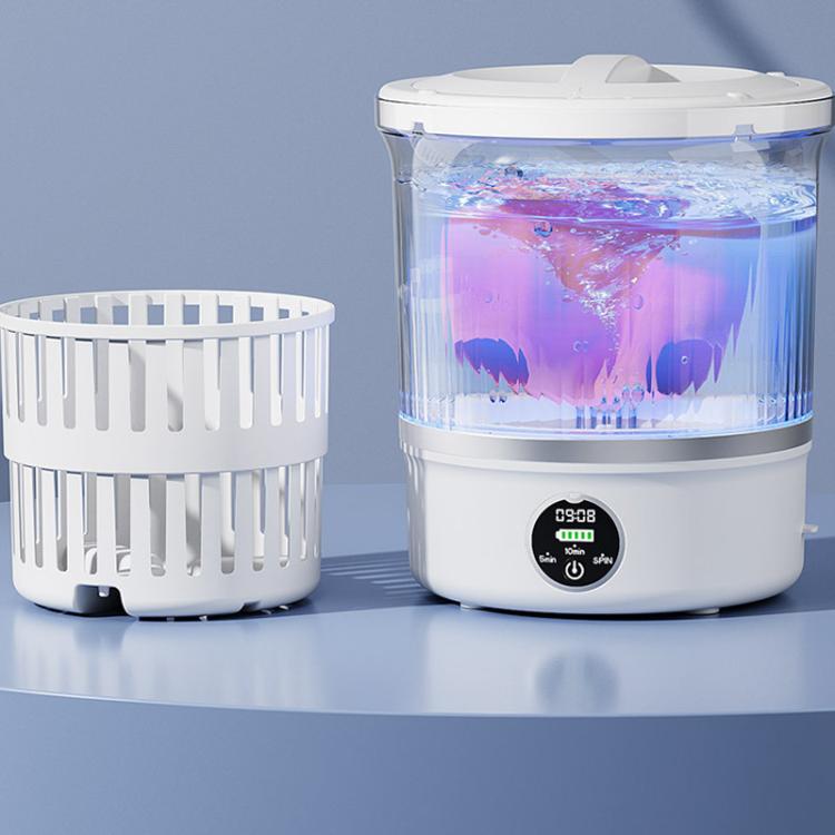 Mini washing machine with clear drum and digital control, shown with white laundry basket