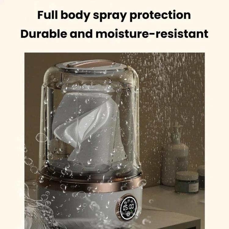 Mini portable washing machine with clear lid, water spray droplets, and round digital timer