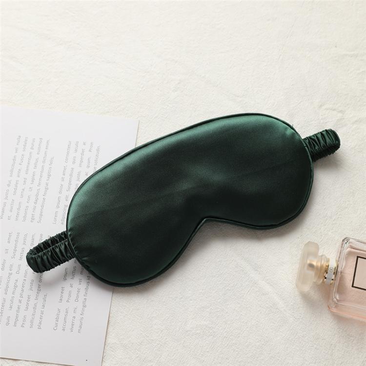 Dark green satin sleep mask with elastic strap, double-sided light-blocking design.