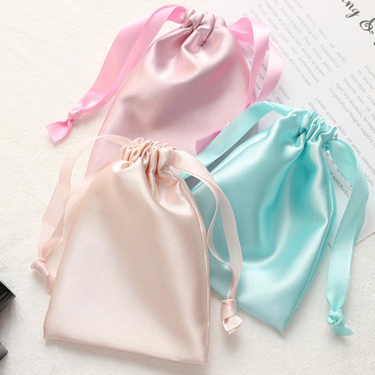 Set of small satin drawstring jewelry pouches, light pink, beige, and mint
