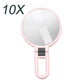 10X magnifying makeup mirror with round glass and pink folding handle