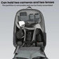 Black camera backpack open with removable partition holding two cameras and lenses.