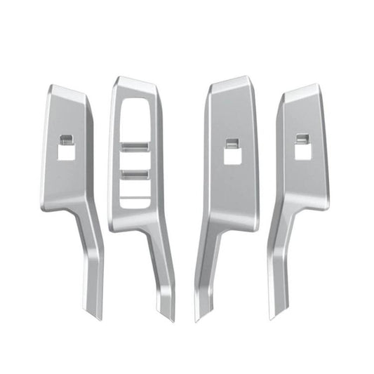 Set of four silver window switch panel trim stickers with cutouts