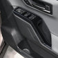 Carbon fiber-look window switch panel trim sticker on car door armrest