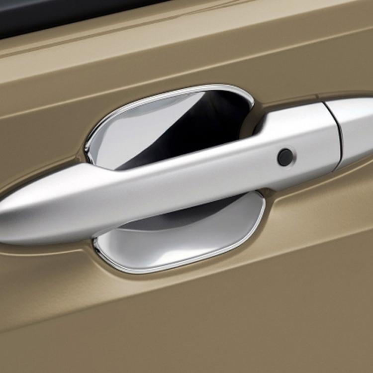 Silver door cup anti-scratch panel sticker on a car door handle area