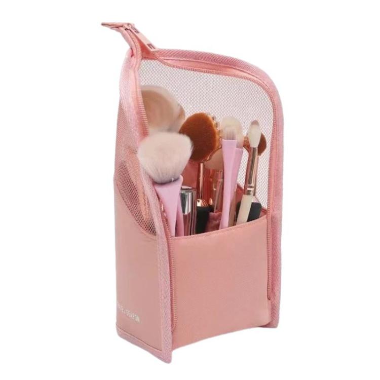 Pink mesh cosmetic bag with zip top, holding makeup brushes and lip products