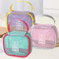 Assorted mesh cosmetic bags in pink and teal with travel label patches and handles
