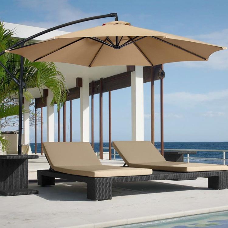 Beige patio umbrella with replacement canopy over outdoor lounge seating