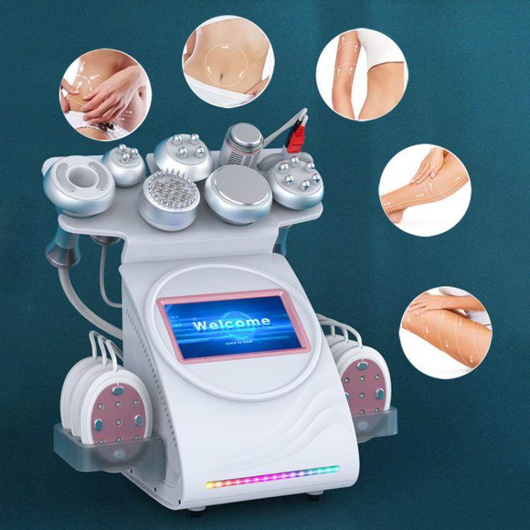White beauty massage machine with round contact pads and multiple attachment heads