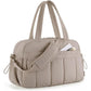 Khaki travel bag with compartments, padded strap, and zippered front pocket