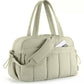 Sage green travel bag with compartments, padded strap, and zippered front pocket