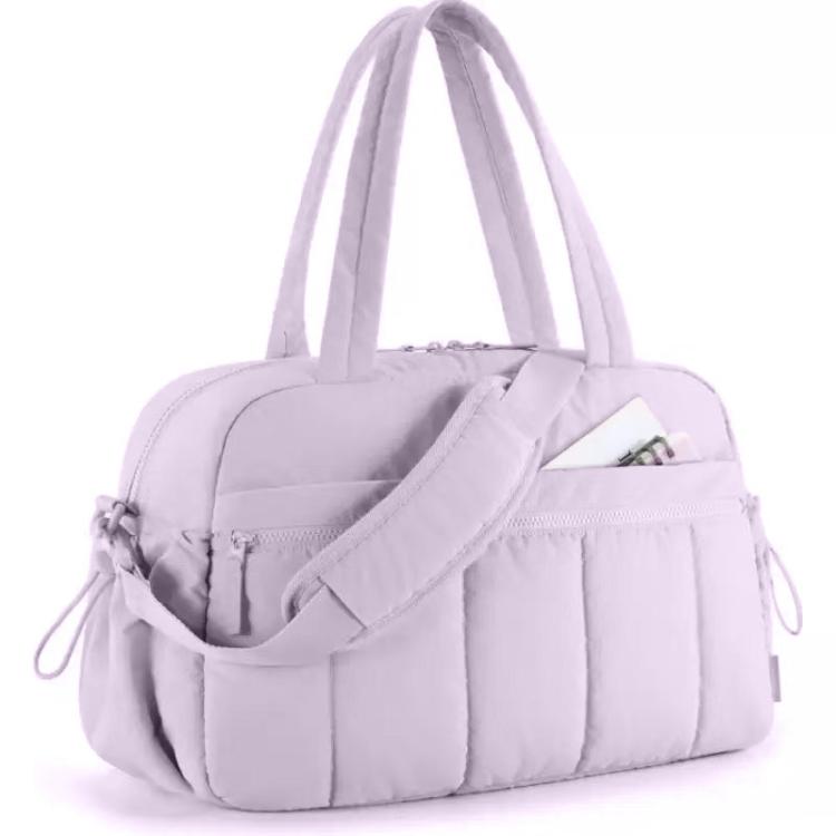 Lavender travel bag with compartments, padded strap, and zippered front pocket