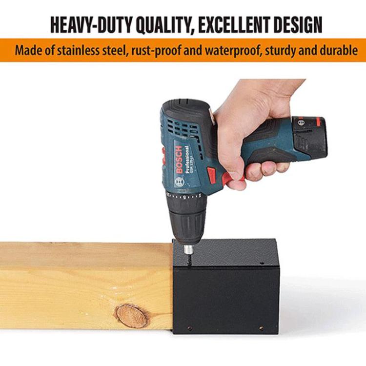 Heavy-duty black metal post protector bracket being drilled on a wooden post