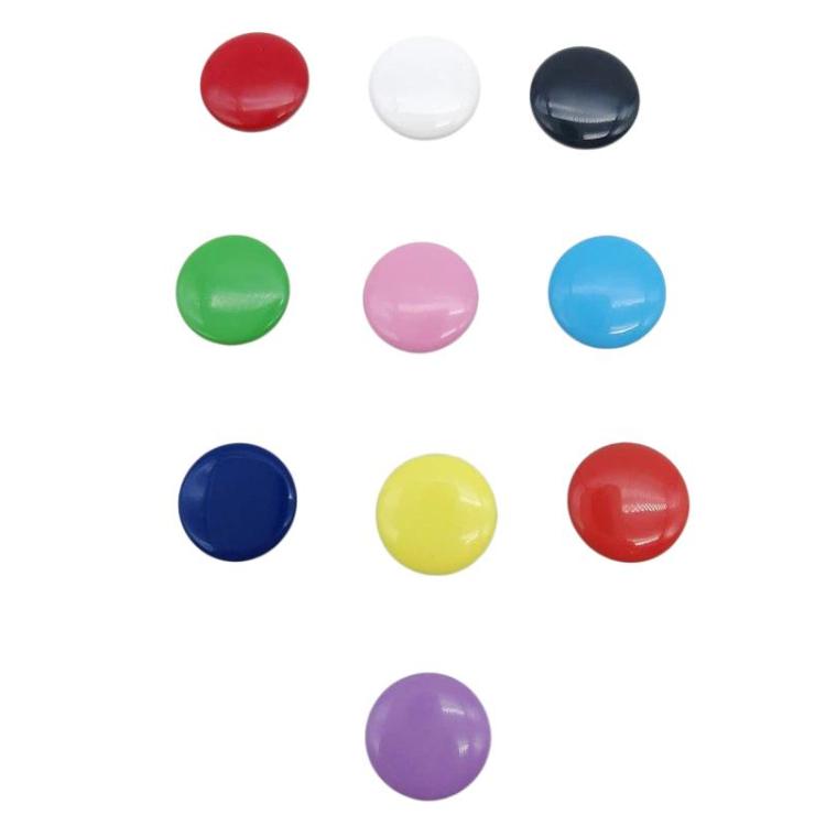 Colored snap fastener tops and caps, round plastic pieces in red, green, blue, and more