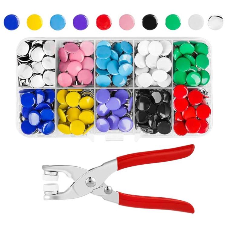 Colorful snap fastener pieces in a divided tray with red-handled pliers
