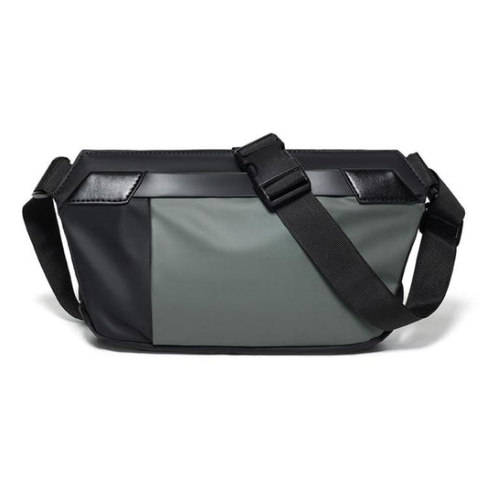 Dark green waterproof sling bag with adjustable crossbody strap and top buckle closure.