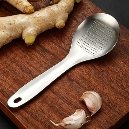 Stainless steel ginger garlic grinder spoon with oval perforated head and handle