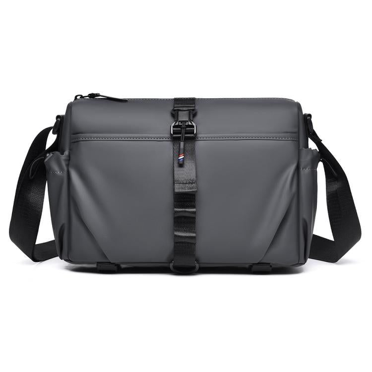 Men's gray sling bag with magnetic front buckle and adjustable shoulder strap