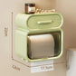 Green wall-mounted tissue storage rack with curved lid and slatted roll compartment