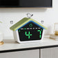 House-shaped digital alarm clock with green LED time display and bird-top accent