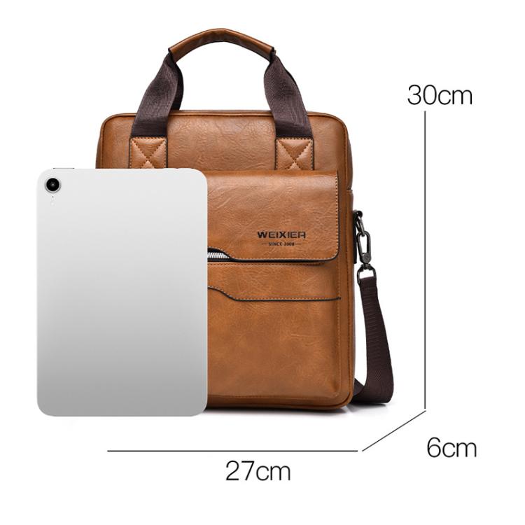 Brown vertical messenger bag shown next to a smartphone for size comparison