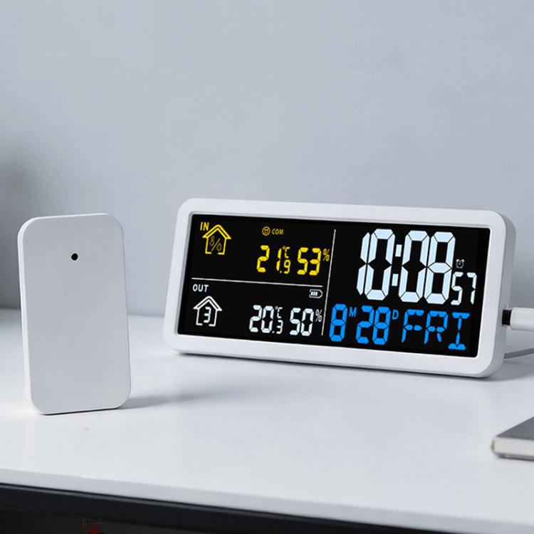 Digital wall clock weather station showing time, indoor/outdoor temperature and humidity.