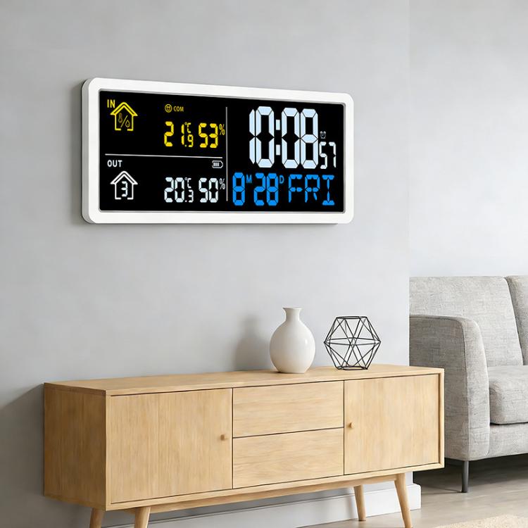 Digital wall clock weather station with LCD showing time and indoor/outdoor temperature readings.