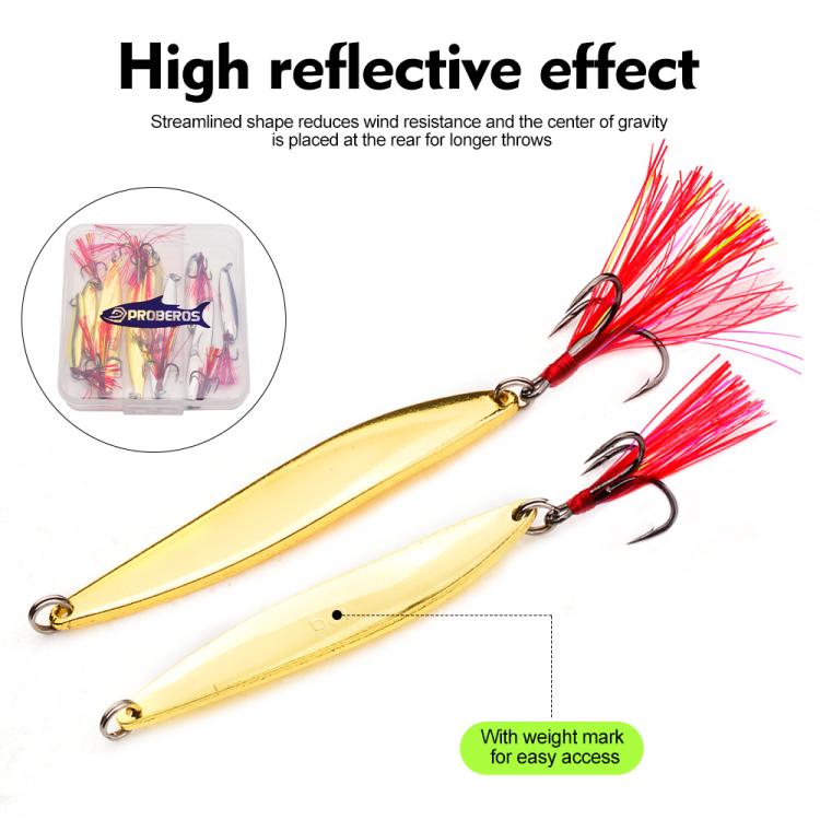 Gold willow leaf spoon lure with red tinsel and treble hooks, shown in clear tackle case