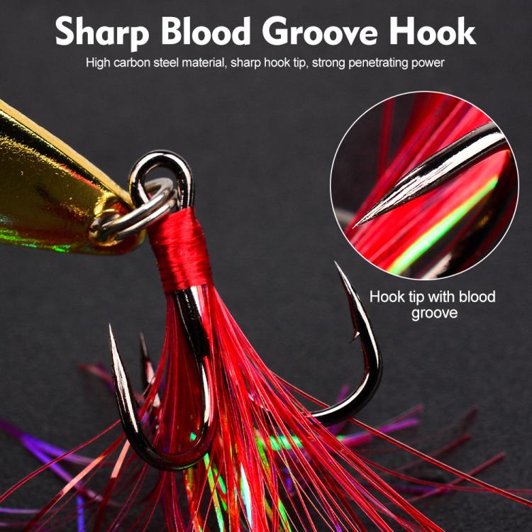 Close-up willow leaf spoon lure: gold blade with red tinsel and treble hook