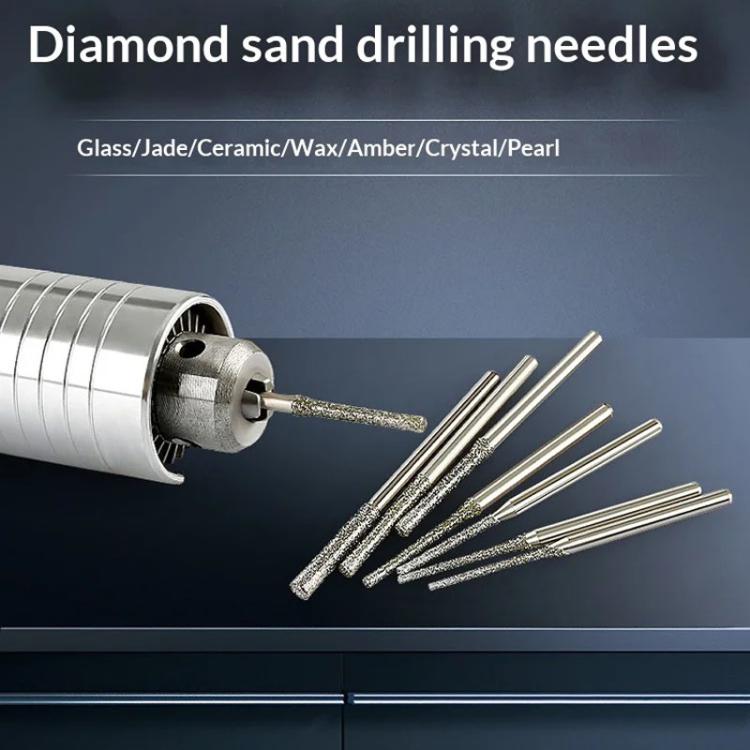 Set of diamond abrasive drill needle bits with a metal chuck and multiple tips.